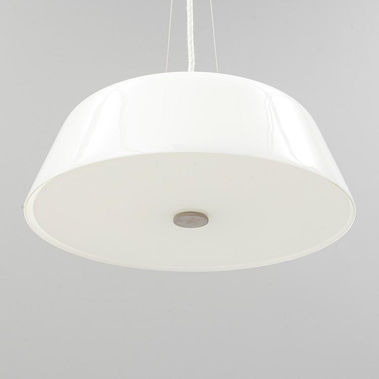 An Arne Jacobsen "Centenary Package" comprising three "Ant Chairs" and an eggshaped table, Fritz Hansen, Denmark.