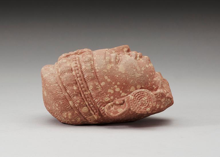 A mottled red sandstone head of Guanyin, Mathura, India, presumably 200-500 AD.