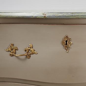 A mid 20th century rococo-style chest of drawers.