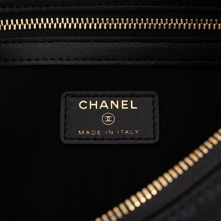 Chanel, a black satin clutch, 2021.