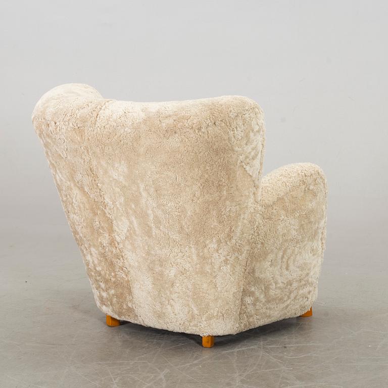 A DANISH SHEEPSKIN ARMCHAIR, 1940-50's.