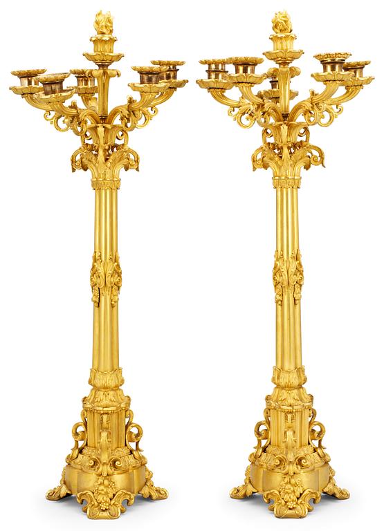 A pair of French late Empire six-light candelabra.