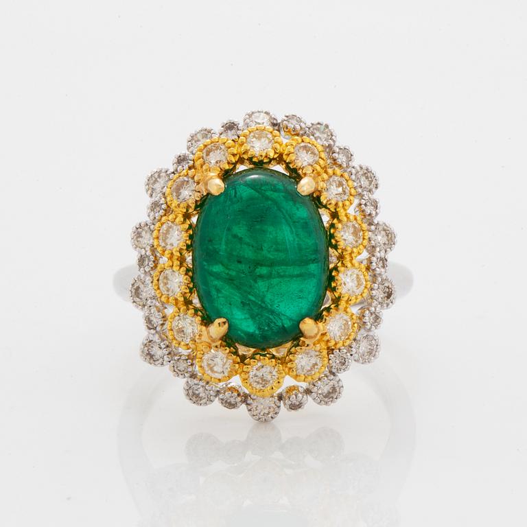 Cabochon-cut emerald and brilliant-cut diamond ring.