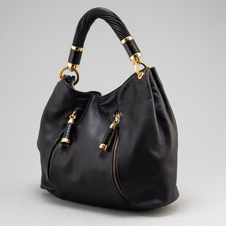MICHAEL KORS, a black leather handbag.