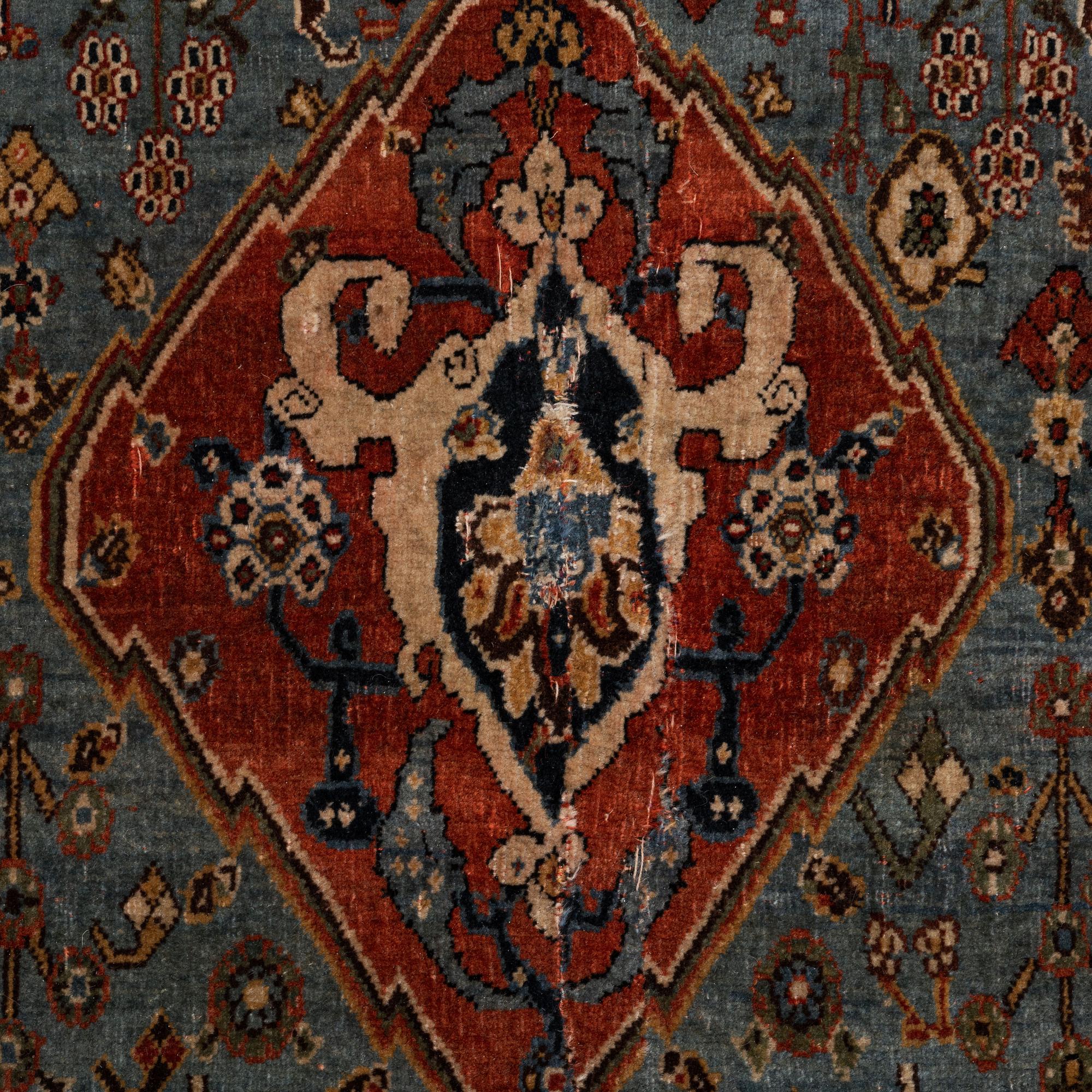 An antique Qashqai rug, southeastern Iran, c 204 x 102 cm.