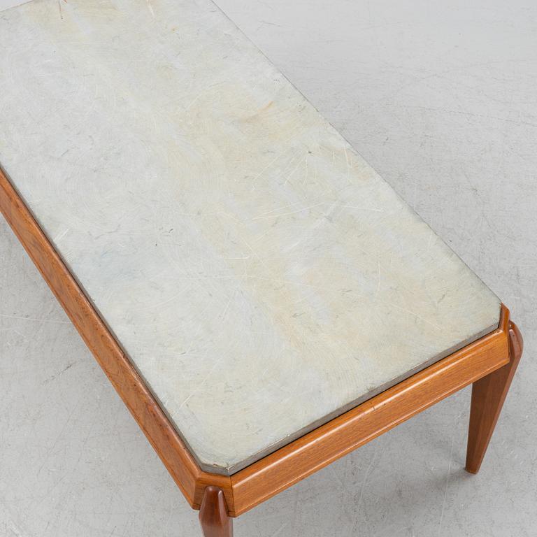 A mid 20th Century coffee table with a stone top.