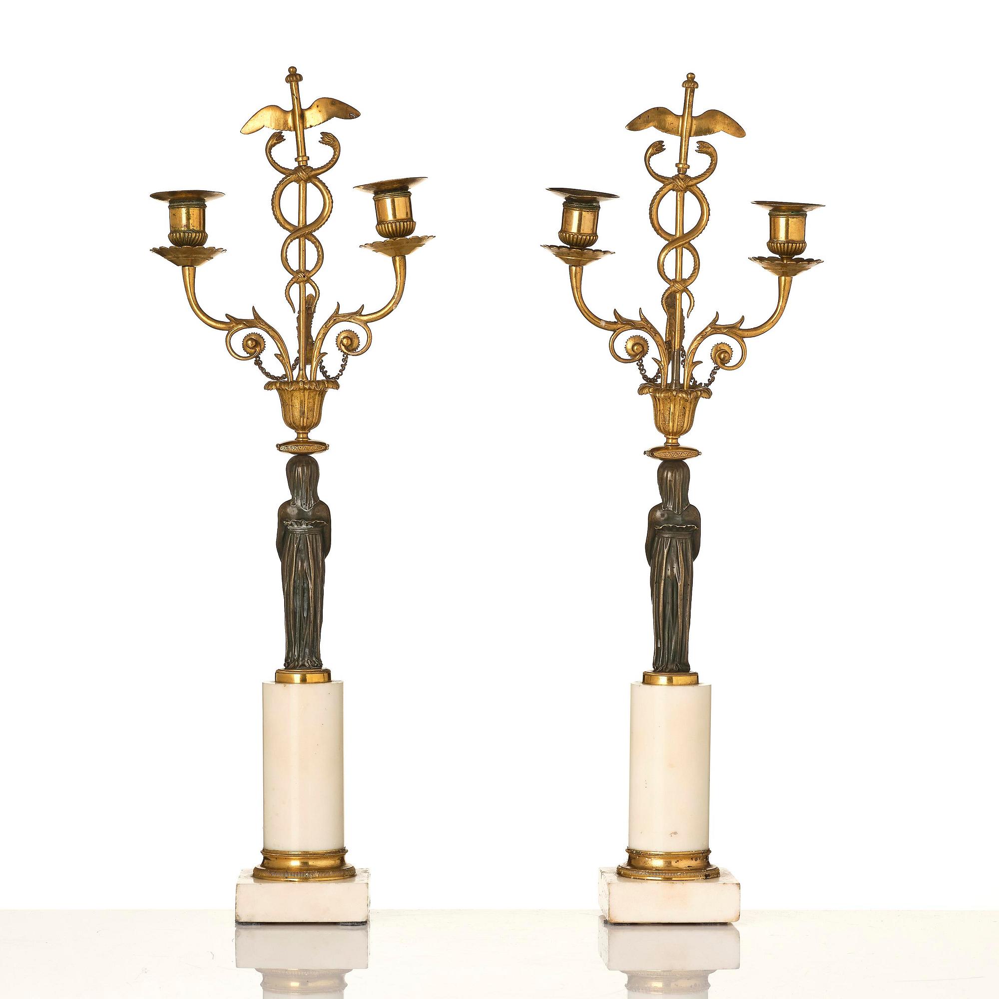 A pair of late Gustavian white marble and bronze candelabra.