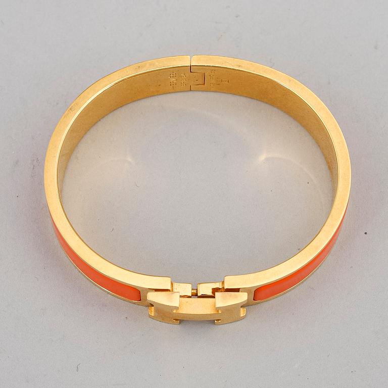 HERMÈS, a 'Clic H' bangle.
