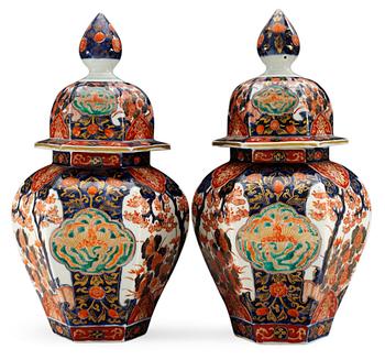 A pair of Imari 19th cent jars with covers, Mieji, Japan.