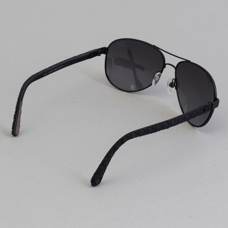 Chanel black pilot summer glasses.