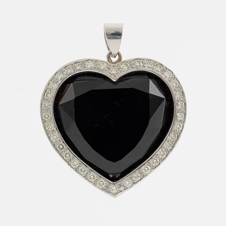 Heart shaped large garnet and round brilliant cut diamond pendant.