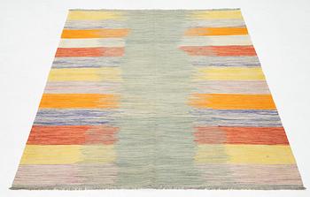 A kilim rug, ca 252 x 175 cm.