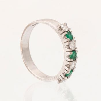 Ring half-eternity 18K white gold with round faceted emeralds and diamonds, Heribert Engelbert Stockholm 1981.