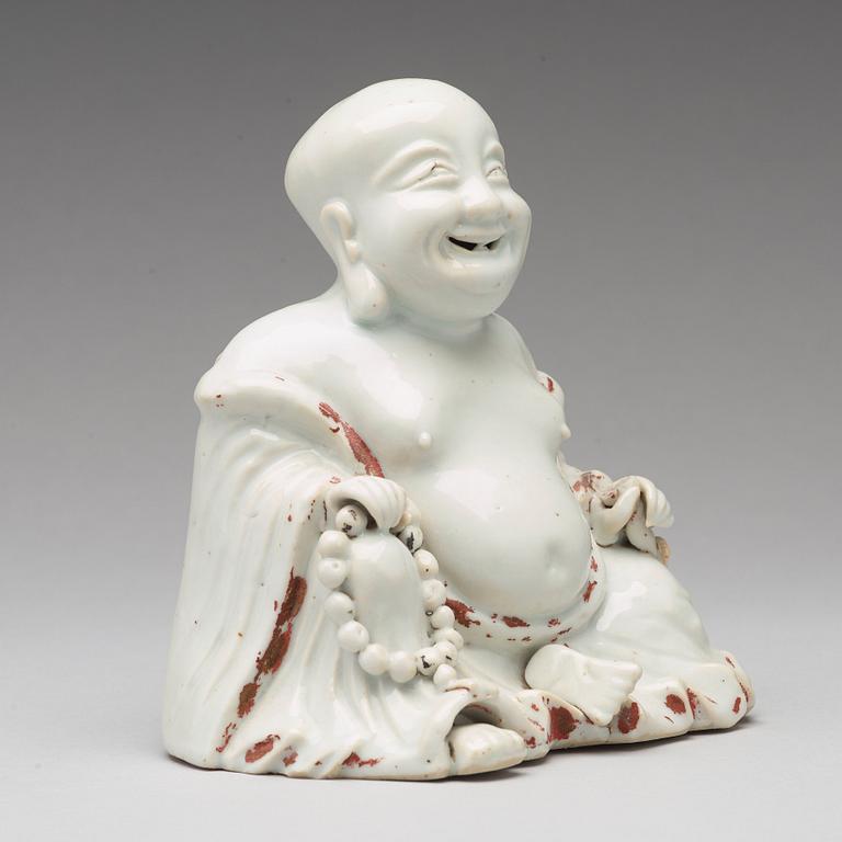 A blanc de chine figure of Buddai, Qing dynasty, 18th Century.