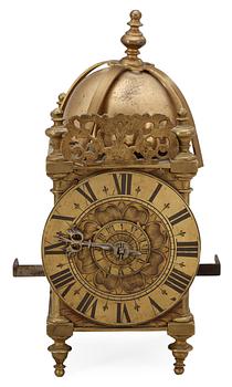 654. An English 17/18th century brass lantern clock.