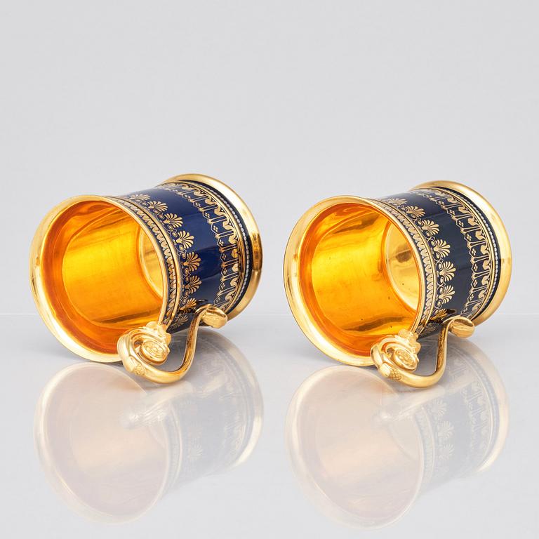 A pair of Sèvres cups with stands, 19th Century.