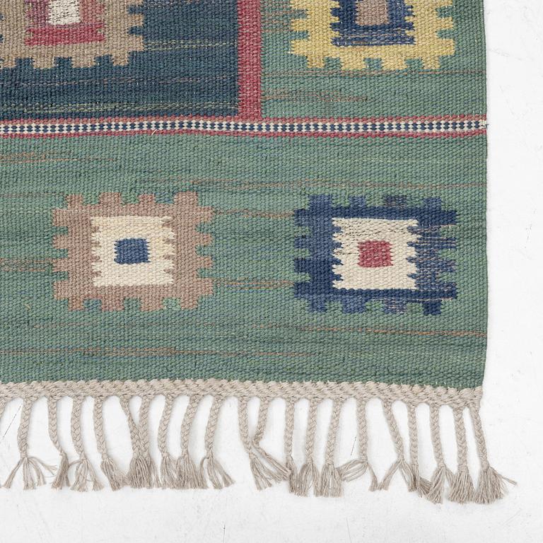 a carpet, 'Grön äng', flat weave, ca 335 x 225 cm, signed AB MMF.