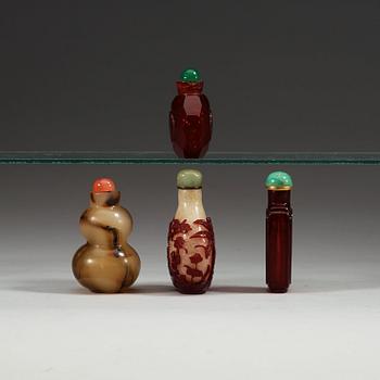 Four Chinese glass snuff bottles, circa 1900.