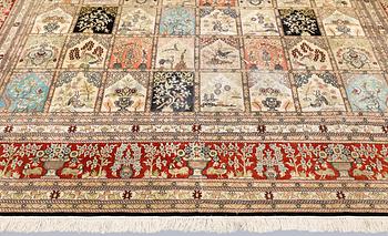 An oriental silk carpet, approx. 376 x 274 cm.