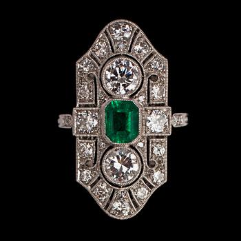 1110. An old cut diamond and step cut emerald ring.