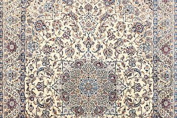 A Nain, part silk carpet, c. 474 x 322 cm.