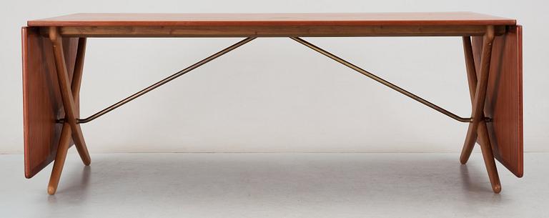 A Hans J Wegner teak and oak sabre leg dinner table by Andreas Tuck, Denmark 1950-60's.