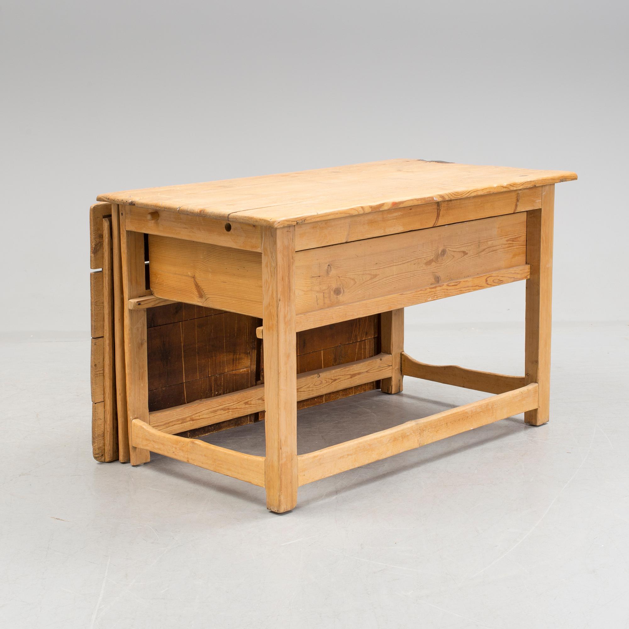 A 19th century pine flap table.