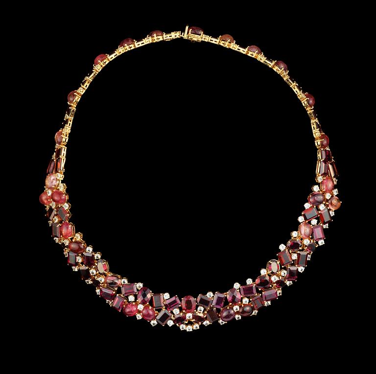 A tourmaline, garnet and white sapphire necklace.