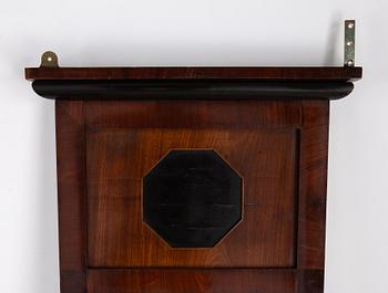 A pair of Biedermeier mahogany mirrors and one console table, 19th century.