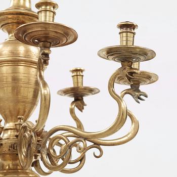 A 19th century eight-light brass chandelier in the manner of Hans Rogiers van Harelbeke.