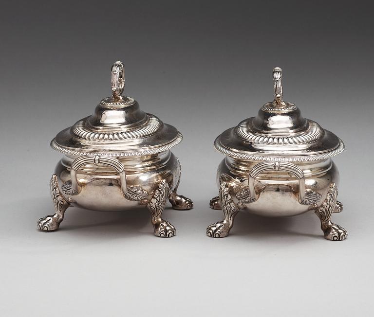 A pair of English 19th century silver sauce tureens, makers mark of Thomas Robins, London 1813-1814.