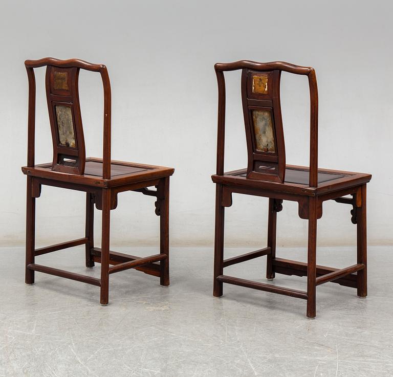 A pair of Chinese hardwood armchairs, early 20th century.