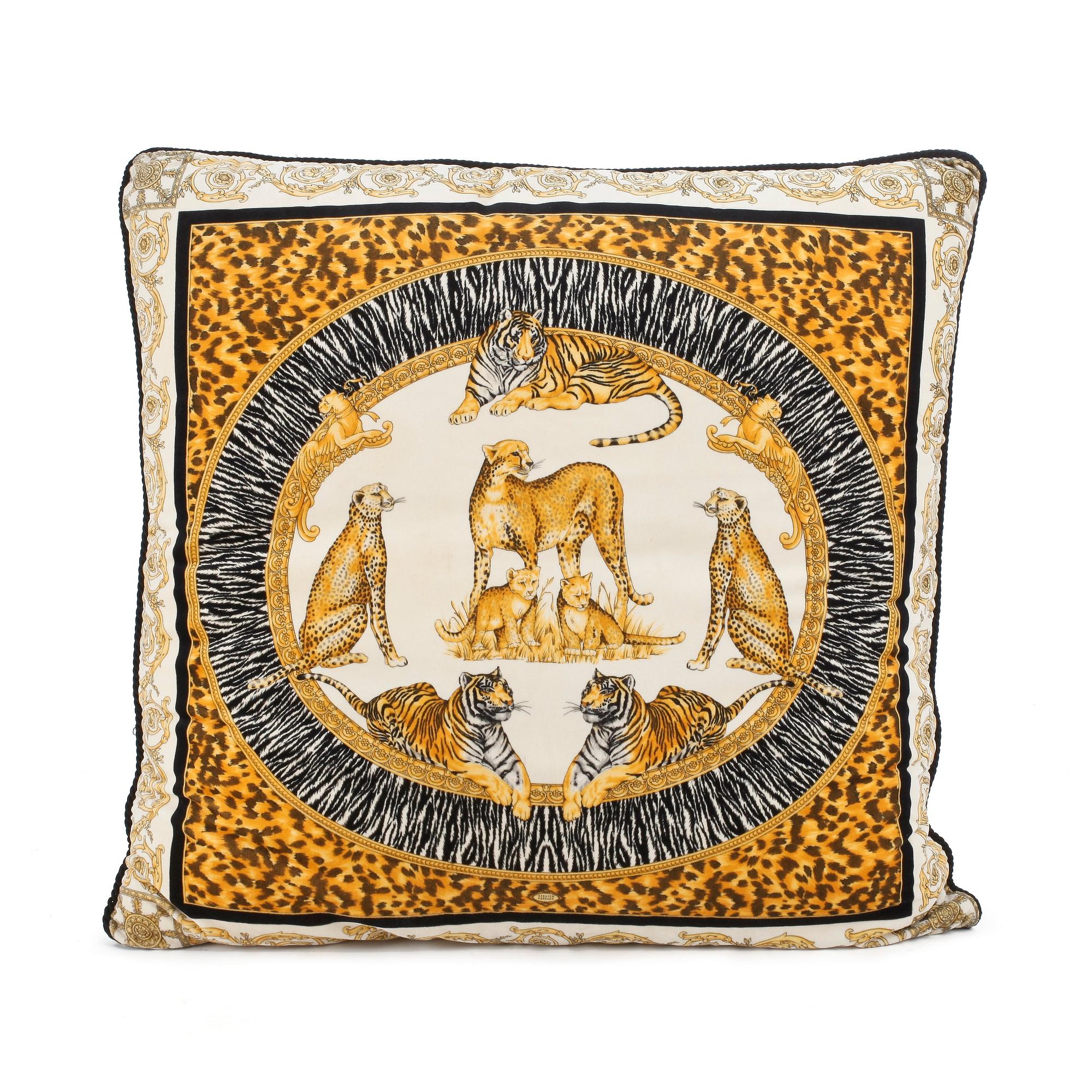 VERSACE, a velvet pillow.