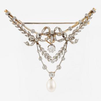 Brooch, gold and platinum, in the form of a bow and garlands with diamonds and a pearl.