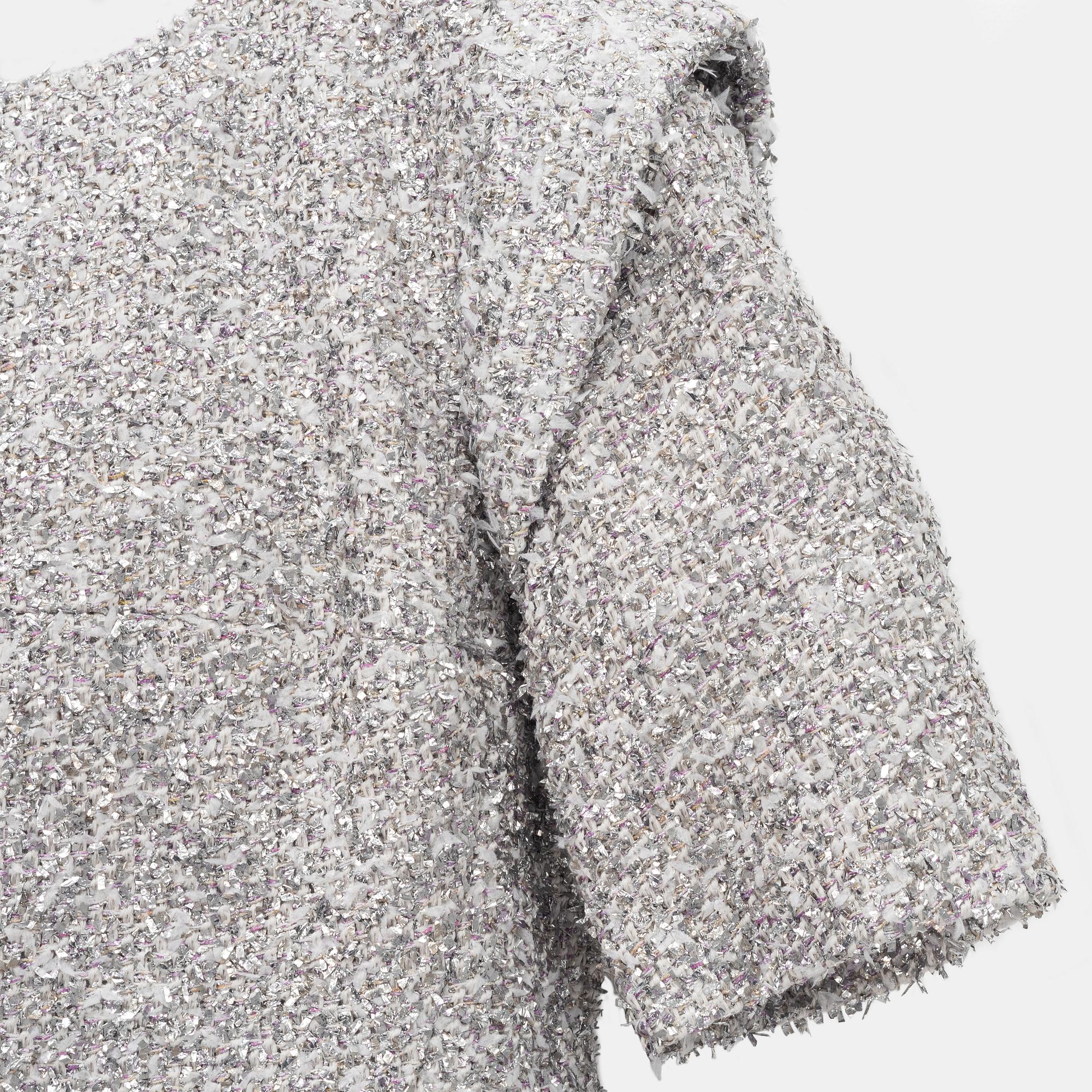 Chanel, a bouclé silver dress, size 34.