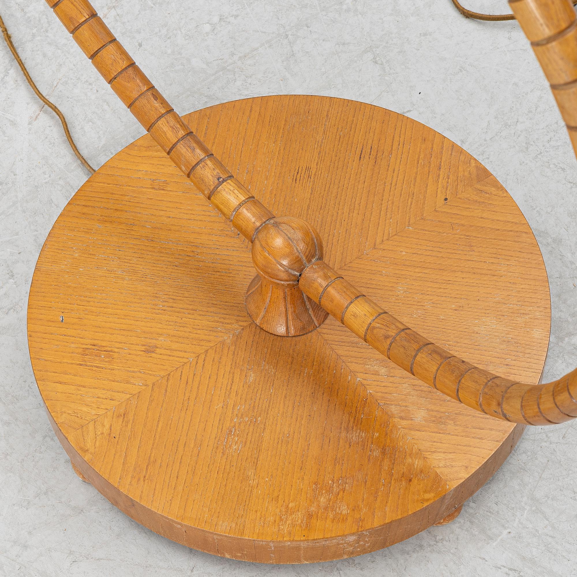 A 1930's/40's floor lamp with table.