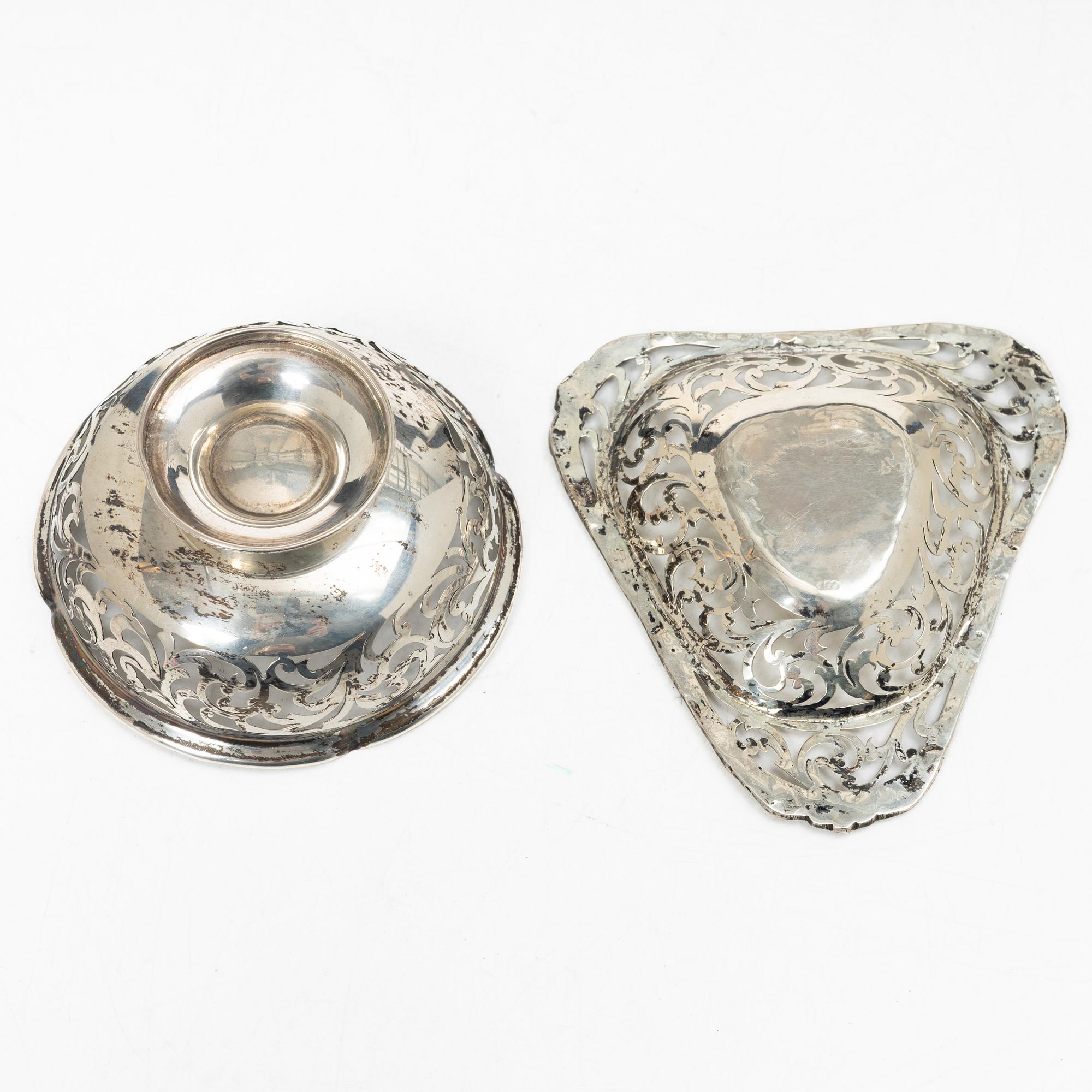 Two pierced silver bowls and two sugar spoons, including Sweden and Endland, 20th century.