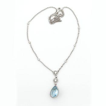 HÄNGSMYCKE, droppslipad topaz med briljantslipade diamanter, tot. ca 0.75 ct.