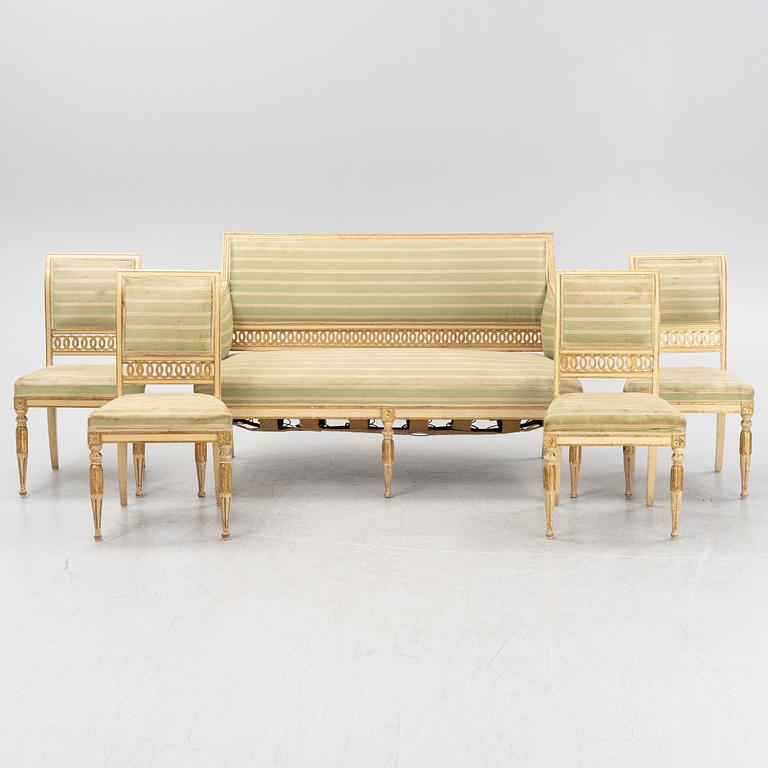 A late Gustaivan style sofa and four matched chairs from around the year 1900.