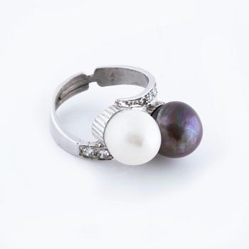 A cultured pearl and single cut diamond ring.