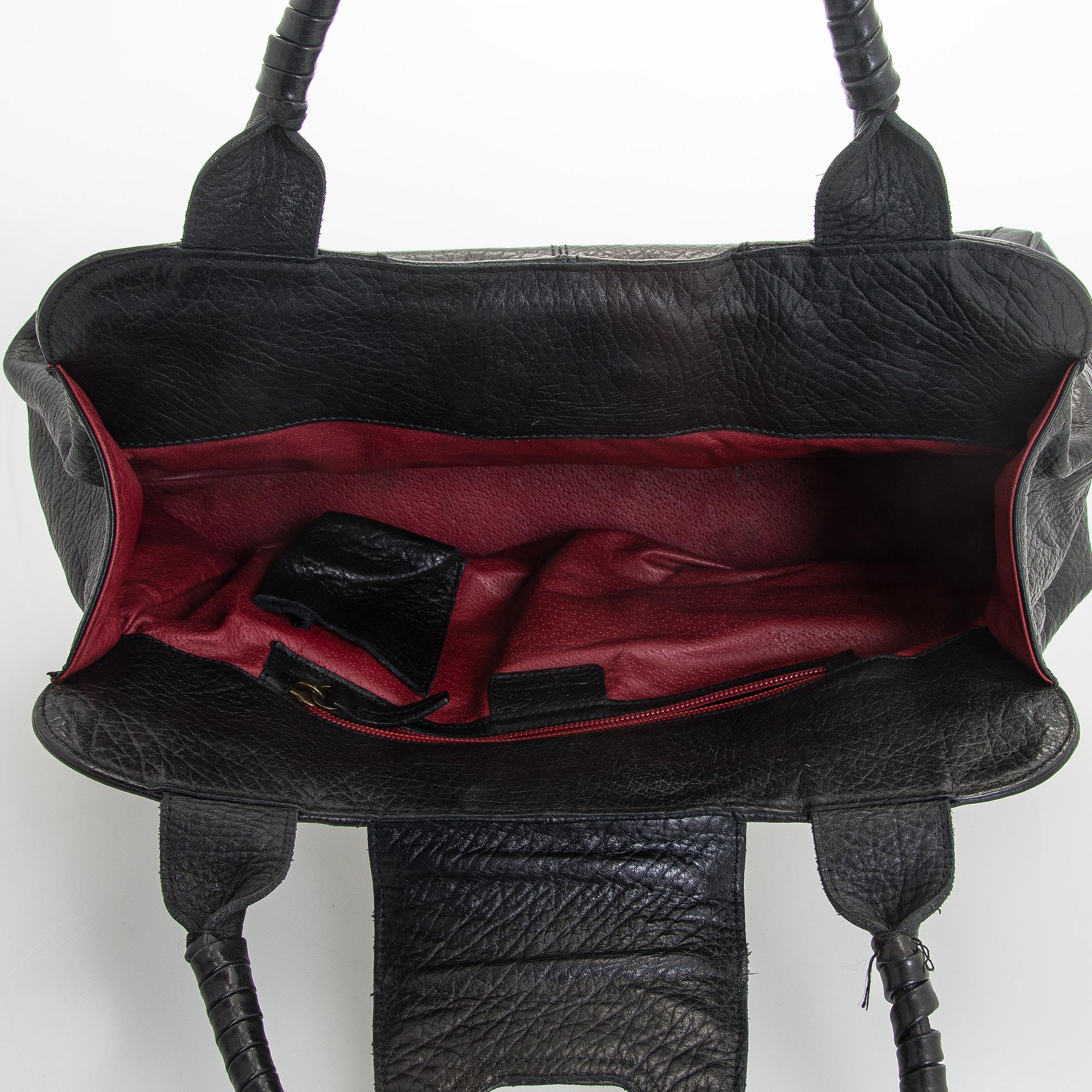 Max Mara, a leather handbag.