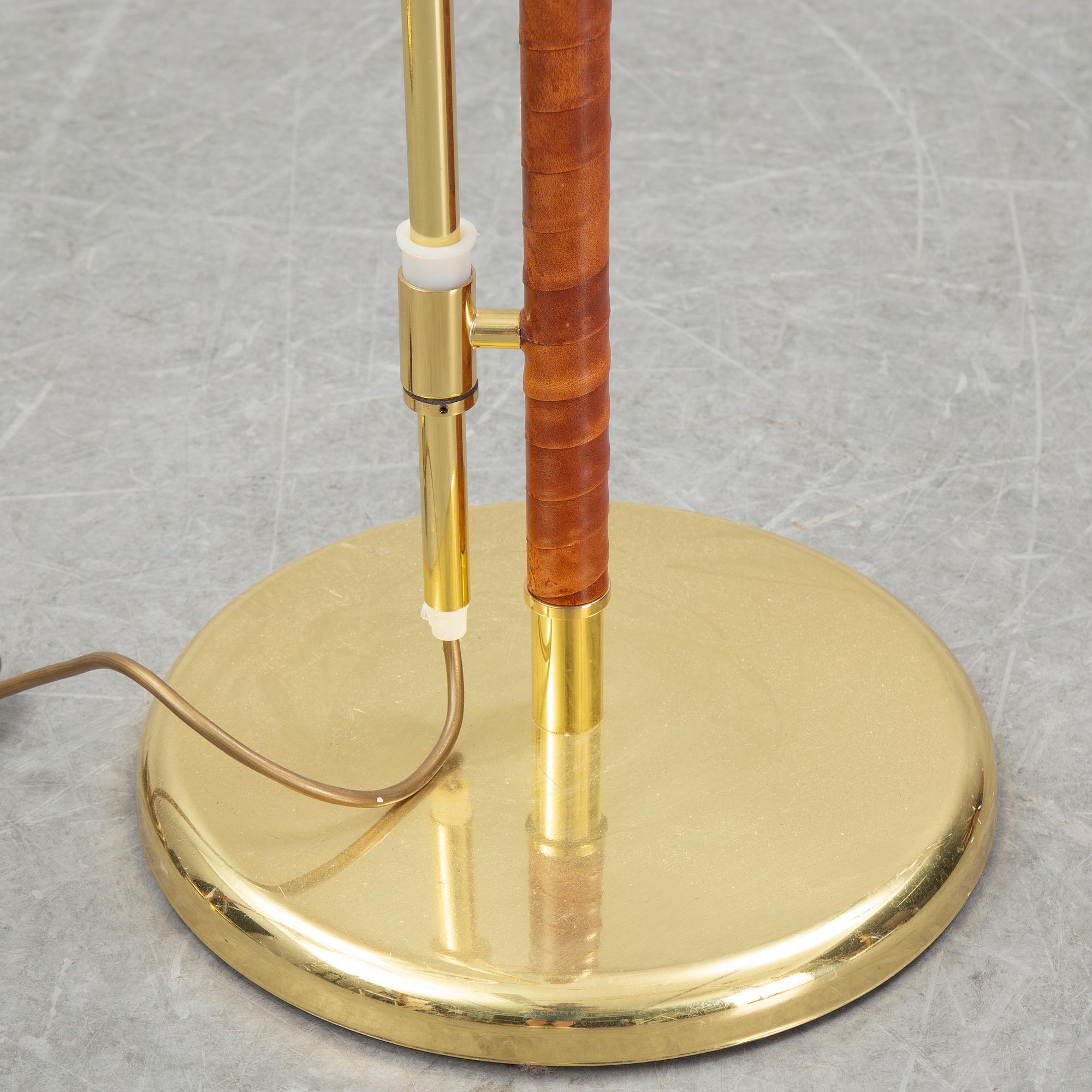A pair of brass and leather floor lights, Örsjö Industri, 21st century.