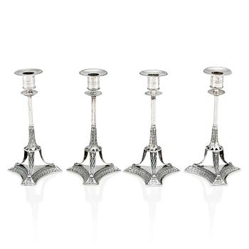 A set of four Swedish early 19th Century silver candlesticks, mark of Adolf Zethelius, Stockholm 1814 and 1818.