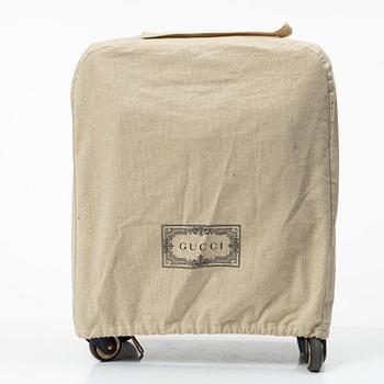 Gucci, suitcase / cabin bag.