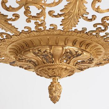 A rococo-revival gilt-brass sixteen-light chandelier, mid 19th century.