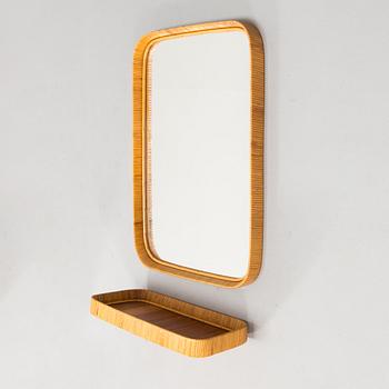 A mid -20th century mirror and consoile.