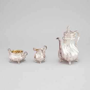 A silver coffee pot, creamer and sugar bowl with swedish import marks, 1930s.