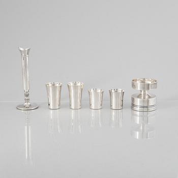 Eric Löfman, a Swedish silver candlestick, a vase and four cups, including MGAB, Uppsala 1977.