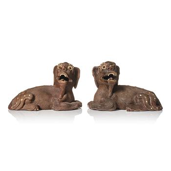1262. A pair of clay figure of buddhist lions, Qing dynasty, signed.