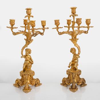A pair of gilt bronze candelabra from the latter half of the 19th century.